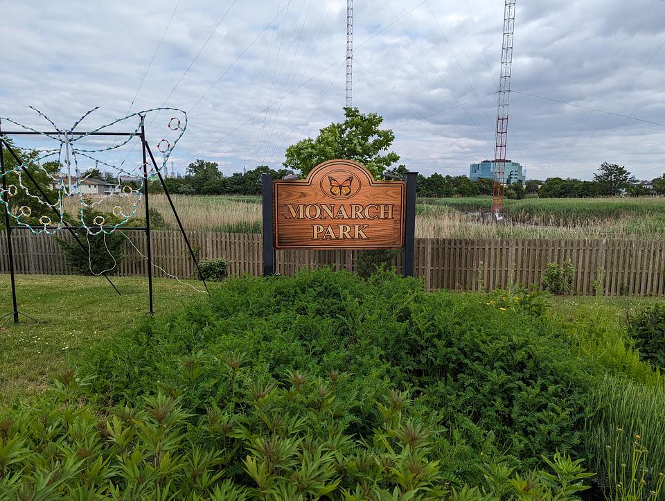 Sign with a monarch butterfly that says Monarch Park